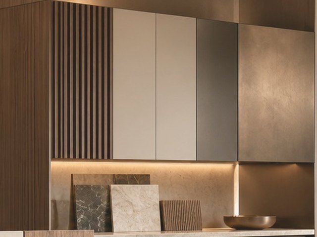 Fluted timber joinery with flat-panel cabinet doors and under-cabinet lighting